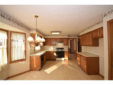 Kitchen includes pantry  for additional storage.