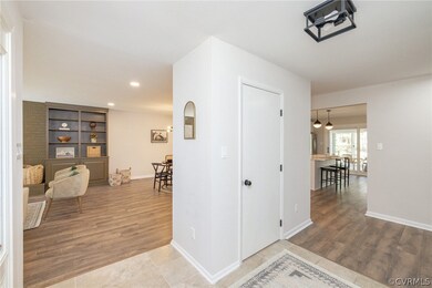 Hallway featuring tile floors