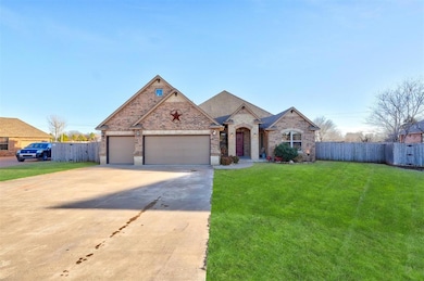 French country home with a garage, brick siding, f
