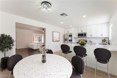 Dining room with light wood finished floors and re