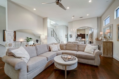 This spacious living area features a cozy sectiona