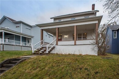Steps lead to the large welcoming front porch.