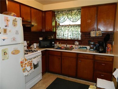 Unit 102 kitchen.  Gas stove and refrigerator.