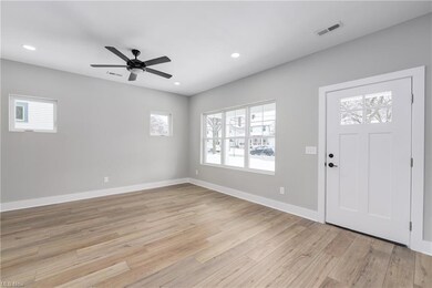Front door view of living room. Natural light and recessed LED lights throughout!