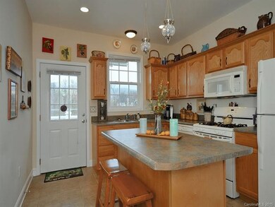 Kitchen with Island and Tile Floor