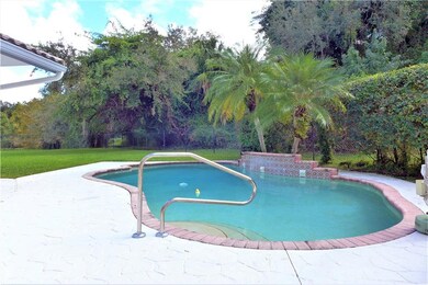 Huge yard with freeform pool with waterfall, lots