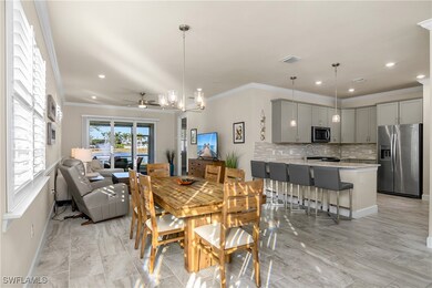 Open concept, crown molding, plank tile flooring,
