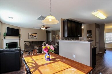 Open concept between kitchen, dining and living ar