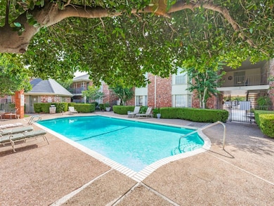 Community pool featuring a patio