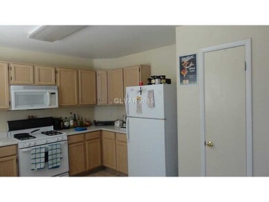 Kitchen. Door to the pantry, and the  refrigerator