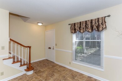 The entry leads to the spacious great room.