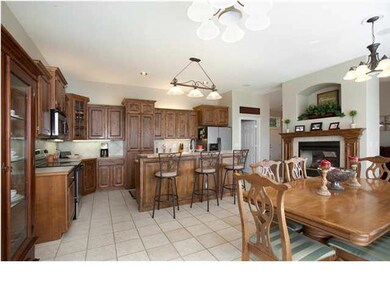 Custom upgraded cabinets hide the walk-in pantry