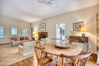 Dining area with lofted ceiling, ceiling fan, and 