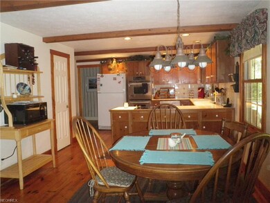 Delightful kitchen with sparkling hardwood floors 
