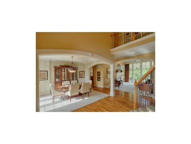 Arched doorways with wood trim.