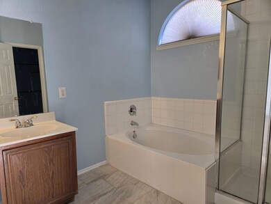Bathroom featuring vanity and plus walk in shower
