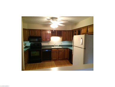 Eat-in kitchen with lots of cabinets and countersp