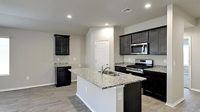 Kitchen featuring appliances with stainless steel 