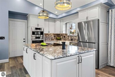 3238 Tamara Cir, Grawn, MI 49637 - photo 4