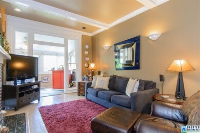 Living room opens to sunroom