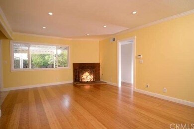 A romantic brick fireplace is the focal feature of