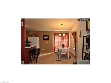view of breakfast bar and dining area with slider 