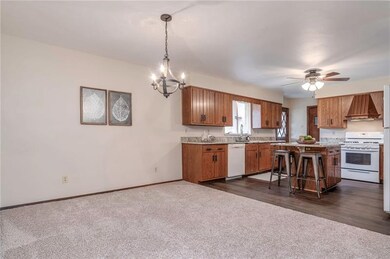 Spacious Dining room featuring new carpet, lightin