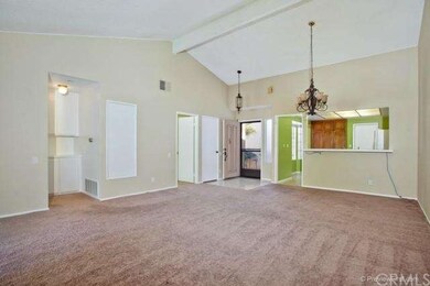 View of living and dining area.  Tile entry helps 