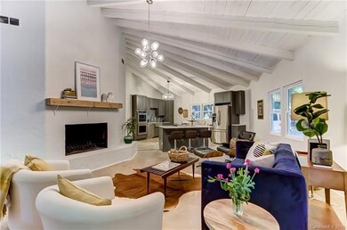 Living room with view of f/p, and looking into the