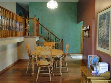 Dining room with hardwood floors, open spacious an