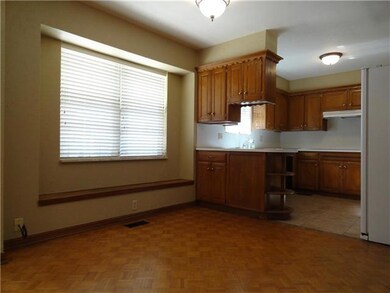 Dining Room. LARGE DOUBLE WINDOWS OVERLOOKING A TR