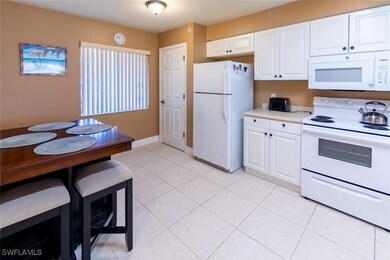 Kitchen featuring light tile patterned floors, whi