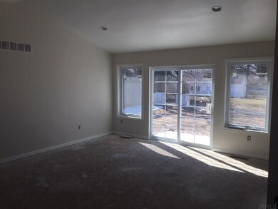 Great Room with Cathedral Ceiling and Sliding Glas