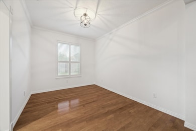 This space could easily serve as a home office or as a play room.