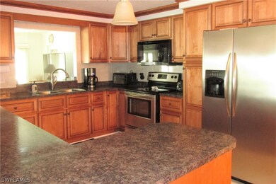 Kitchen w/pass through above sink to FL room.