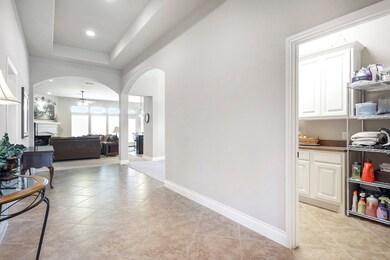 Laundry room to the right just off of the entry hall and the door leading to the garage.