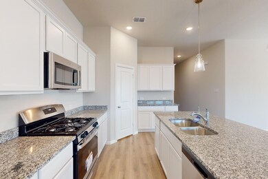 Kitchen featuring stainless steel appliances, whit