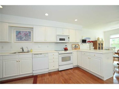 Kitchen. The kitchen is huge with white cabinetry 