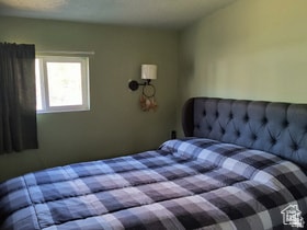 Bedroom featuring a textured ceiling