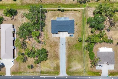Land on both sides of the driveway to accommodate additional buildings