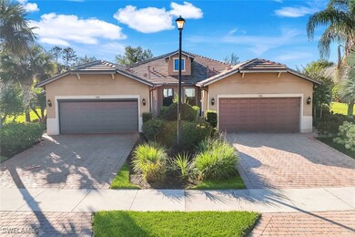 View of front of home with Tiled Roof, Paver Drive