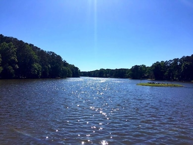 Property view of water with a forest view