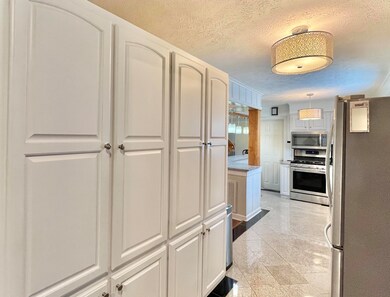 A wonderful wall of cabinets will serve as your pa