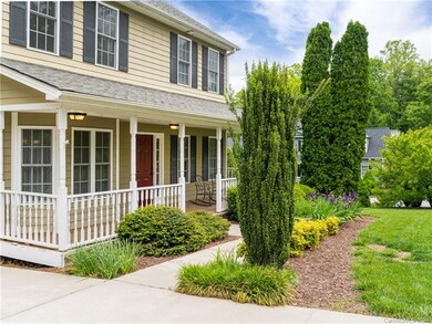 Low maintenance shrubs and bulbs welcome you home.