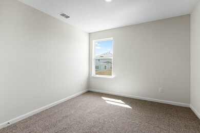 Carpeted spare room with baseboards