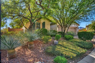 View of property hidden behind natural elements with stucco siding and an attached garage