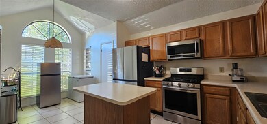 This kitchen features ample natural light with lar