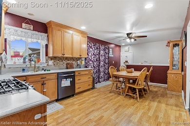 Kitchen with backsplash, light wood finished floors, stainless steel dishwasher, a ceiling fan, and recessed lighting