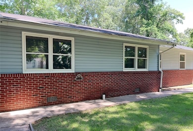 View of property exterior with crawl space and bri