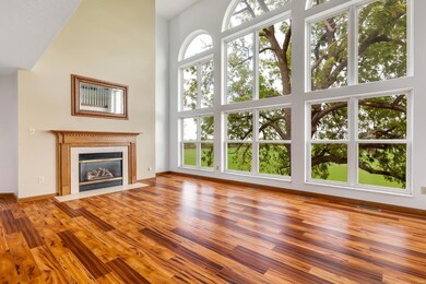 Atrium wall of windows in the great room with Fire